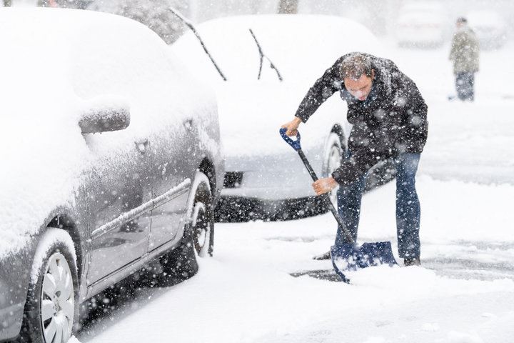 Picture of a man shoveling snow
